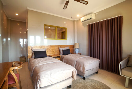 Twin room with 2 beds in the Bayu Hotl Lipah Beach.
