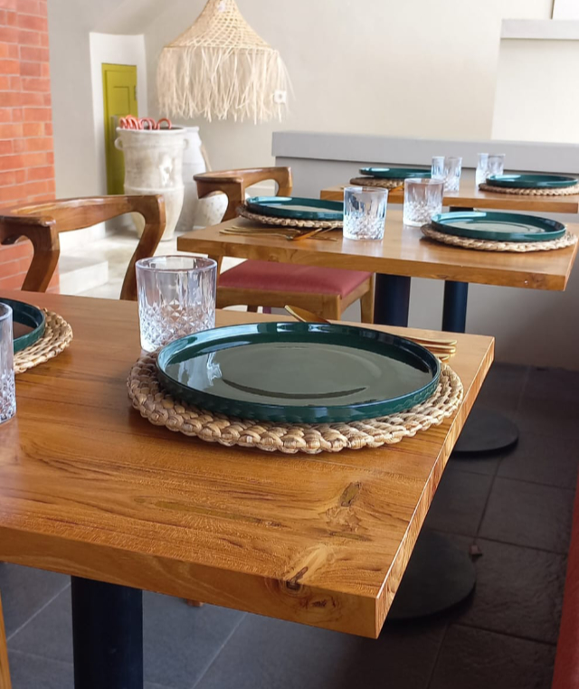 Table and plates at the Bayu Hotel Lipah Beach restaurant.